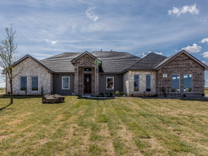 A well-protected home with a durable roof in Corsicana's winter landscape, courtesy of King Roofing and Solar.