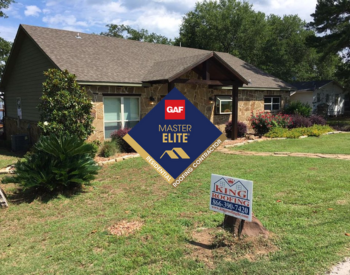 GAF Master Elite certification badge on a roof installation