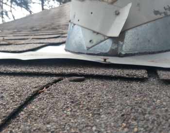 Damaged roof flashing needing repair in Mabank home.