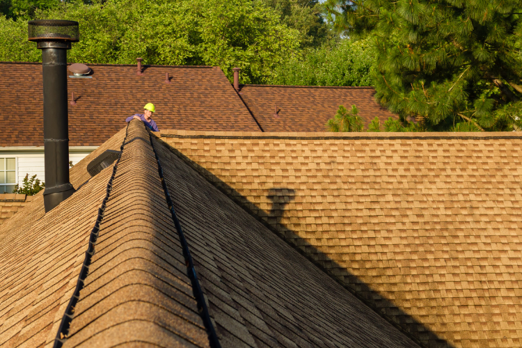 Roofing contractor inspecting roof in Mabank, TX